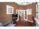 Inviting office space with hardwood floors, built-in shelving, and elegant french doors at 9101 Highland Ridge Way, Tampa, FL 33647