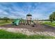 Community playground with multiple slides and play structures in a park-like setting at 9101 Highland Ridge Way, Tampa, FL 33647
