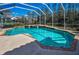 A pool featuring tile accents, a brick trim, and an attached spa at 9101 Highland Ridge Way, Tampa, FL 33647