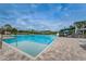 Large community pool with lap lanes, splash area, and plenty of lounge seating for residents at 9101 Highland Ridge Way, Tampa, FL 33647