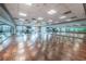 Bright studio with wood floors, mirrored walls, and fitness equipment for a versatile workout experience at 9101 Highland Ridge Way, Tampa, FL 33647
