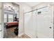Bright bathroom featuring a glass-enclosed shower and a glimpse into a bedroom at 9645 Little Bluestem Dr, Land O Lakes, FL 34637