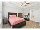 Main bedroom with coffered ceiling, en-suite bathroom, and walk-in closet at 9645 Little Bluestem Dr, Land O Lakes, FL 34637