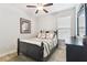 Bright bedroom with ceiling fan and warm neutral colors at 9645 Little Bluestem Dr, Land O Lakes, FL 34637