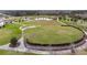 This community park features a large field, stage, seating, pond, and walking trails at 9645 Little Bluestem Dr, Land O Lakes, FL 34637
