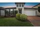 Inviting two-story home with a well-maintained lawn and charming curb appeal at 9645 Little Bluestem Dr, Land O Lakes, FL 34637