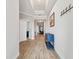 Hallway with decorative wall art and furniture at 9645 Little Bluestem Dr, Land O Lakes, FL 34637