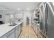 Spacious kitchen with stainless steel appliances, modern cabinetry, and quartz countertops at 9645 Little Bluestem Dr, Land O Lakes, FL 34637