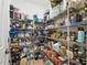 Well-organized walk-in pantry with metal shelving and laminate floors at 9645 Little Bluestem Dr, Land O Lakes, FL 34637