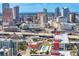 Aerial view showcasing downtown cityscape with modern high-rise buildings and a glimpse of the bay at 1120 E Kennedy Blvd # 1126, Tampa, FL 33602