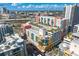 Aerial view featuring a rooftop pool surrounded by lush landscaping and city views at 1120 E Kennedy Blvd # 1126, Tampa, FL 33602