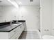 A modern bathroom features a double sink vanity and a spacious glass shower at 1120 E Kennedy Blvd # 1126, Tampa, FL 33602