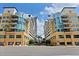 Exterior of yellow residential building with a street view of the shops and restaurants at 1120 E Kennedy Blvd # 1126, Tampa, FL 33602