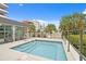 Private rooftop hot tub with seating, railing, and plants, and buildings in the background at 1120 E Kennedy Blvd # 1126, Tampa, FL 33602