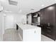 A modern kitchen features stainless steel appliances and a large center island at 1120 E Kennedy Blvd # 1126, Tampa, FL 33602
