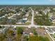 See the aerial view highlighting houses with pools and big yards nestled within a peaceful suburban community at 11304 Sedgefield Ave, Spring Hill, FL 34608