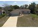 Charming home featuring a two-car garage, neutral exterior, and well-kept lawn, offering curb appeal at 11304 Sedgefield Ave, Spring Hill, FL 34608