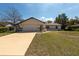 Charming single-story home boasting a two-car garage, neutral paint, and a well-manicured lawn at 11304 Sedgefield Ave, Spring Hill, FL 34608