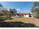 Backyard view of a private screened-in pool and patio, perfect for relaxing and enjoying the outdoors at 11304 Sedgefield Ave, Spring Hill, FL 34608