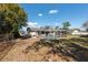 Spacious backyard with a screened-in pool, offering a private outdoor oasis for relaxation and recreation at 11304 Sedgefield Ave, Spring Hill, FL 34608