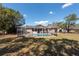 Inviting screened-in pool area with a sparkling blue pool and ample space for lounging and enjoying the outdoors at 11304 Sedgefield Ave, Spring Hill, FL 34608