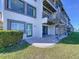 Waterfront condo featuring a private patio, spiral staircase, and well maintained landscaping at 173 Marina Del Rey Ct, Clearwater Beach, FL 33767