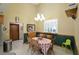 Cozy dining area featuring a chandelier, plantation shutters, and comfortable seating at 18405 Keystone Grove Blvd, Odessa, FL 33556