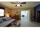 This main bedroom features light wood floors, fan, and access to a screened-in patio at 18405 Keystone Grove Blvd, Odessa, FL 33556