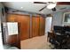 Office featuring wood shelves, wood furniture, computer equipment and gray textured walls at 18405 Keystone Grove Blvd, Odessa, FL 33556