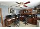 Office featuring wood shelves, wood furniture, computer equipment and gray textured walls at 18405 Keystone Grove Blvd, Odessa, FL 33556