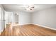 Light and airy bedroom with beautiful wood-look floors, neutral walls, and bright white trim at 2041 Australia W Way # 35, Clearwater, FL 33763