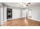 Bright bedroom featuring hardwood floors, ceiling fan and closet with stackable washer and dryer at 2041 Australia W Way # 35, Clearwater, FL 33763
