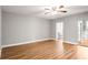 Spacious bedroom with wood-look flooring leading to the bathroom at 2041 Australia W Way # 35, Clearwater, FL 33763