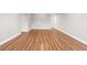 Spacious living room featuring wood-look floors and neutral gray walls at 2041 Australia W Way # 35, Clearwater, FL 33763