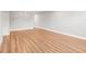 Open living room showcasing wood-look floors and neutral gray walls at 2041 Australia W Way # 35, Clearwater, FL 33763