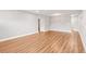 Bright living room with wood-look floors, neutral walls, and modern lighting at 2041 Australia W Way # 35, Clearwater, FL 33763