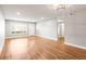 Bright living room with wood-look floors, neutral walls, and recessed lighting at 2041 Australia W Way # 35, Clearwater, FL 33763