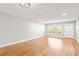 Bright living room featuring wood-look floors, neutral walls, and modern lighting at 2041 Australia W Way # 35, Clearwater, FL 33763
