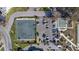 Aerial view of community shuffleboard court, parking lot, and walking path at 2041 Australia W Way # 35, Clearwater, FL 33763