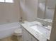 Clean bathroom featuring a tub/shower, granite countertops, and tile floors at 3147 Sunwatch Dr, Wesley Chapel, FL 33544