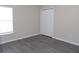 Standard bedroom with hard surface floors, window, and a closet at 3147 Sunwatch Dr, Wesley Chapel, FL 33544