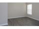 Comfortable room with hard surface flooring, neutral paint, and a large window at 3147 Sunwatch Dr, Wesley Chapel, FL 33544