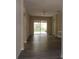 Light-filled living room with sliding doors to the back yard at 3147 Sunwatch Dr, Wesley Chapel, FL 33544