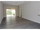 Bright and sunny open living area with sliding glass doors leading to the back patio at 3147 Sunwatch Dr, Wesley Chapel, FL 33544