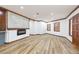 Bright and airy living room showcasing modern flooring, a sleek fireplace, and an open layout at 32608 Knollwood Ln, Wesley Chapel, FL 33545