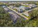Aerial view of a residential community with pond and mature landscaping at 3313 Pleasant Willow Ct, Brandon, FL 33511