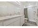 Bright bathroom with double sink vanity and shower with gray accents at 3313 Pleasant Willow Ct, Brandon, FL 33511