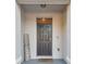 Cozy front entry with decorative wreath and welcome sign creating a warm ambiance at 3313 Pleasant Willow Ct, Brandon, FL 33511