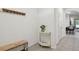 Clean hallway featuring neutral colors and decor, connecting various rooms at 3313 Pleasant Willow Ct, Brandon, FL 33511