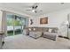 Spacious living room with comfortable seating and sliding glass doors leading to the outdoors at 3313 Pleasant Willow Ct, Brandon, FL 33511